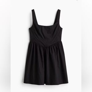 Black mini dress with corset top and flared skirt